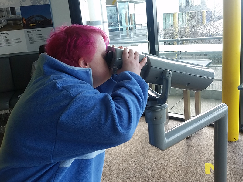 Aileen using binoculars